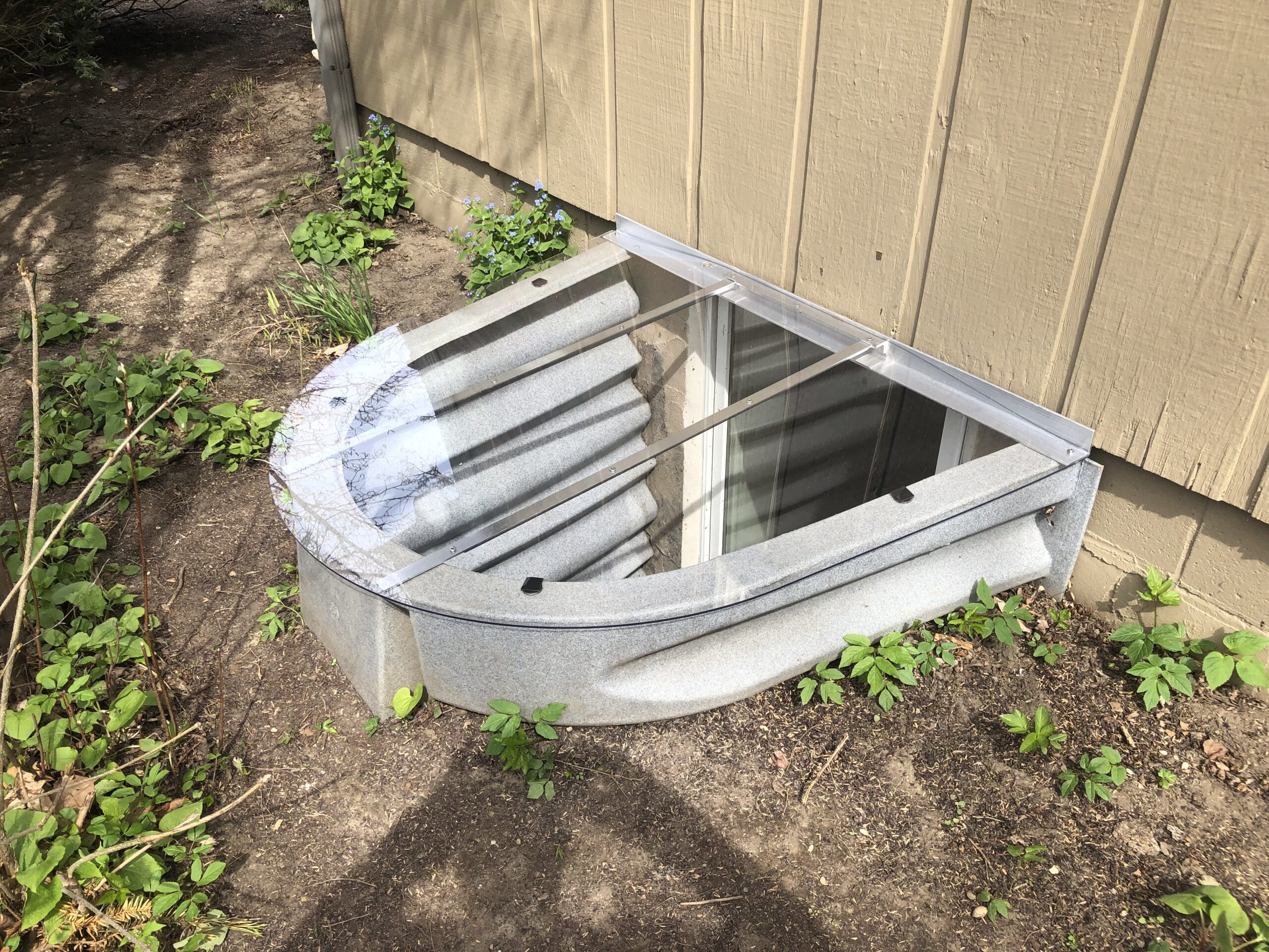 Wellcraft egress window well with outside view installed in Ohio basement