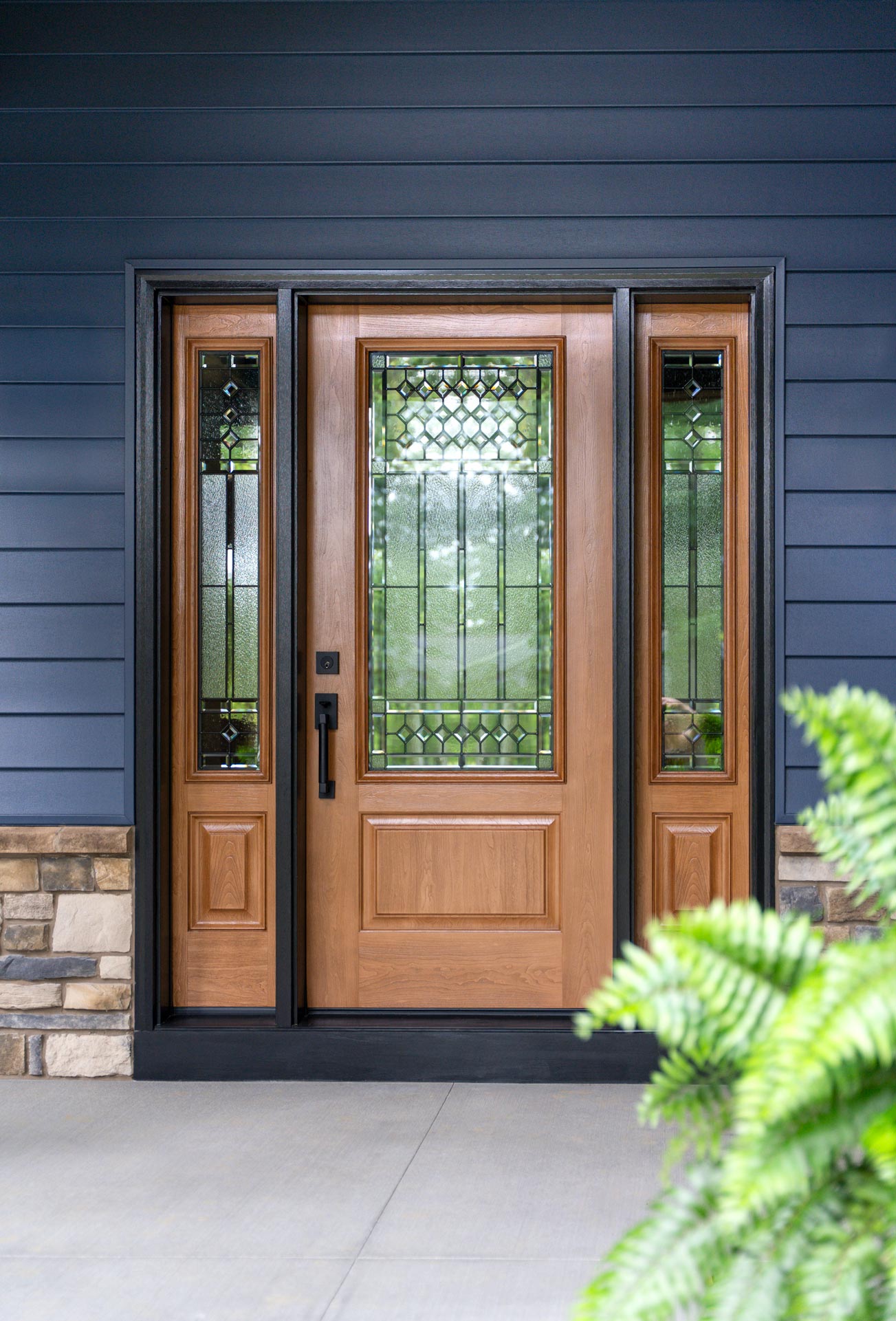 Fiberglass entry door with sidelites and decorative glass installed by Evolve on an Ohio home