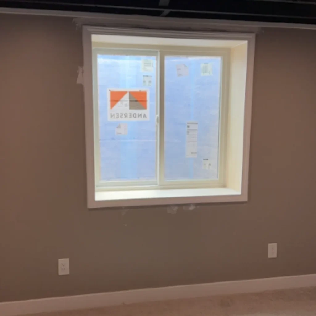 New egress window viewed from a finished basement interior in Ohio